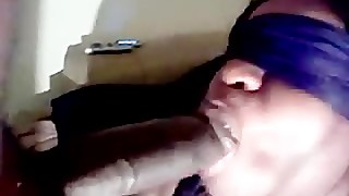 Blindfolded black wife sucks black cock